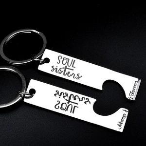 Detail of interlocking stainless steel keychains with Soul Sisters engraving