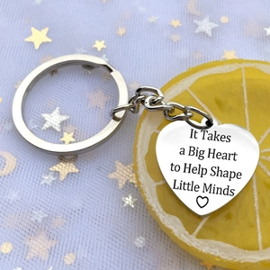 Polished stainless steel heart keychain with inspirational teacher quote engraving