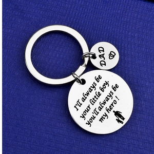 Macro detail of stainless steel keychain with I'll always be your little boy engraving
