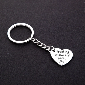 Stainless steel heart keychain with 'Teaching is a work of Heart' engraving for teachers