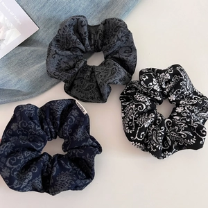 Three-piece paisley pattern wool scrunchie set in gray, blue, and monochrome tones