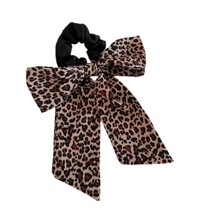 Vintage leopard print bow scrunchie hair tie with long ribbons for elegant hairstyling