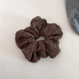 Deep brown crochet knit scrunchie with soft hollow texture for autumn winter ponytail styles