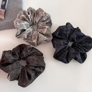 Three-piece set of retro paisley print scrunchies in grey and black textured fabric