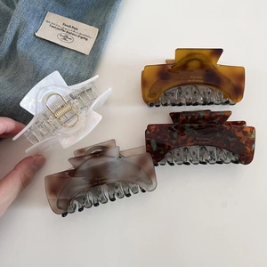 Elegant French style large resin hair claws in amber and marble patterns for women