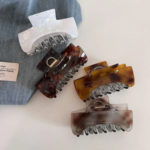 Elegant tortoiseshell and marble patterned acetate hair claws in various stylish colors