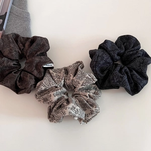 Three-piece set of high-quality paisley pattern scrunchies in coffee, beige, and dark grey fabric