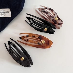 Ensemble de grandes pinces à cheveux en résine écaille et noir avec logo doré