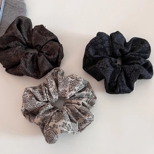Three-piece set of premium paisley pattern scrunchies in brown, blue, and beige colors