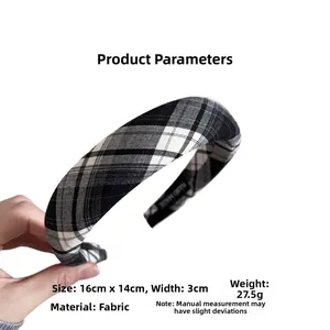 Detail showing classic black and white plaid fabric headband with handmade inner label