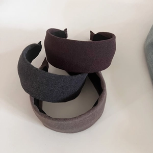 Three simple wide wool headbands in burgundy, dark grey and beige for women's hairstyle