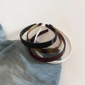 Lot de 4 serre-têtes en acrylique côtelé aux couleurs assorties pour un look cheveux volumineux