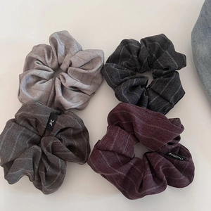 Set of 4 vintage striped fabric scrunchies in grey, black, and burgundy with woven labels