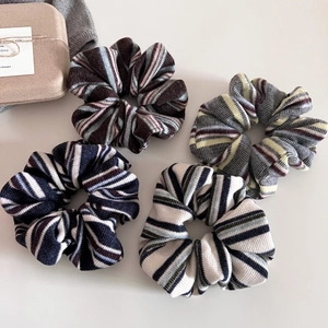 Set of four vintage American style striped knitted scrunchies with soft ribbed texture