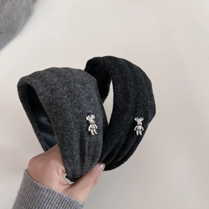 Elegant wide padded grey and black fuzzy headbands featuring a silver metal bear charm