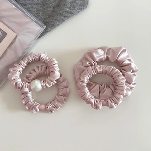Pink satin scrunchie set with pearl accents in French minimalist elegant style