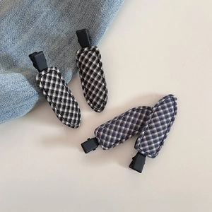 Minimalist plaid fabric hair clips in black and blue patterns with matte metal base