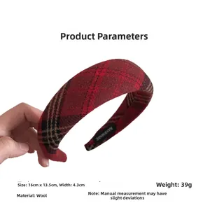 Detail view of red plaid wool headband showing 16cm by 13.5cm dimensions and texture