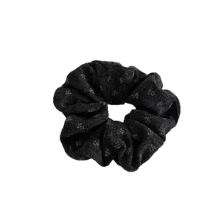 Black fabric scrunchie with silver snowflake pattern for elegant women hair styling