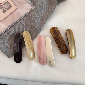 Set of six colorful acetate spring hair clips in retro tones with a glossy finish
