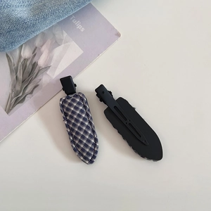 Minimalist blue plaid fabric hair clip set with matte metal base on a tulip card