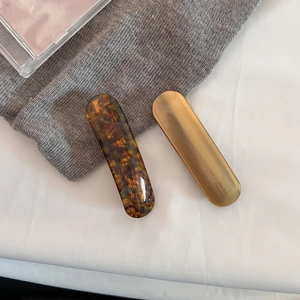 Detail of tortoise shell and matte gold hair clips with FRANCE Handmade engraving
