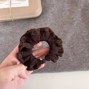 Brown leopard print oversized hair scrunchie made of soft fabric with a black buckle