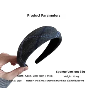 Detail showing the dimensions and thick grey wool plaid texture of the padded headband