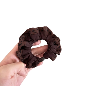 Elegant leopard print scrunchie for women made of brown pattern and solid fabric