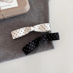 Polka dot bow banana hair clips in black and white fabric for versatile styling