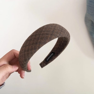 Detail view of handmade brown plaid tweed headband with high top sponge filling