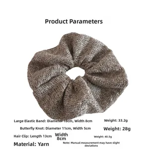 Macro view of coffee knit scrunchie with detailed dimensions 18cm diameter and 33g weight