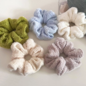 Detailed view of 5-pack colorful knitted hair scrunchies in soft pastel macaron tones