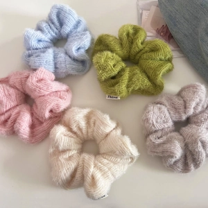 Set of 5 colorful fuzzy knit scrunchies in pastel shades like blue pink and green