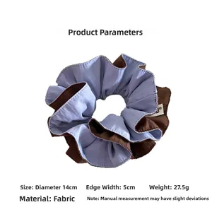 Detail showing two-tone scrunchie in blue and brown with dimensions 14cm diameter