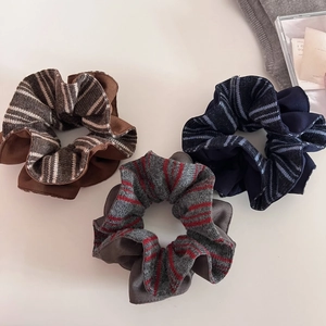 Set of three striped knitted scrunchies in coffee, navy blue, and grey for women