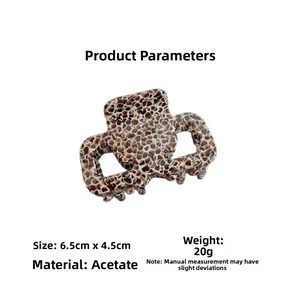 Detail view showing tortoise shell acetate hair claw clip dimensions 6.5cm by 4.5cm