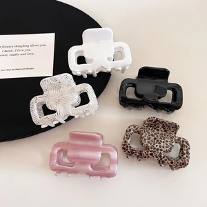 Set of five minimalist square acetate hair claws in black, white, leopard, and marble patterns