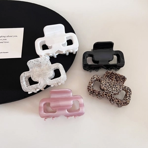 Close-up of square acetate hair claws in leopard, marble, and solid colors set