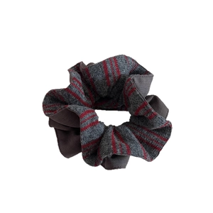Knitted dark grey scrunchie with red stripes featuring a textured elastic design