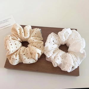 Set of two hollow lace scrunchies in cream and white with elegant eyelet embroidery