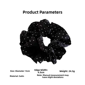 Detailed view of 13cm black satin polka dot scrunchie with dimensions and weight info