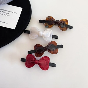 Elegant bow acetate hair clips in tortoiseshell pearl white and red for women