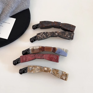 5-piece set of acetate bow banana hair clips in diverse vintage marble patterns