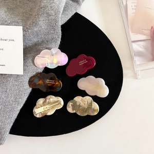 Detailed set of cloud-shaped acetate hair clips in multiple colors with metal back clips