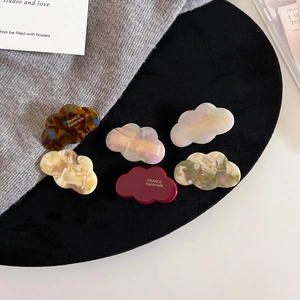 6-piece cloud-shaped acetate hair clips in assorted colors with handmade gold lettering