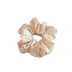 Elegant hollow lace scrunchie in creamy white knit fabric for sweet hair styling
