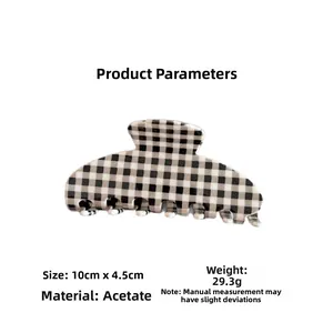 Detail view of large checkered acetate hair claw clip showing 10cm x 4.5cm dimensions
