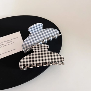Classic checkered acetate hair claw clips in black and blue for elegant women's hairstyles