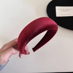 Close-up of deep red velvet padded headband showing premium thick texture and soft gloss